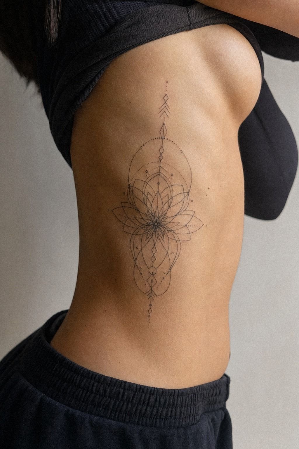 Place A Sacred Geometry Rib Tattoo