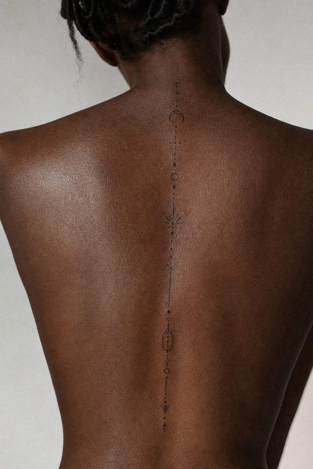Tiny Symbols Along the Spine