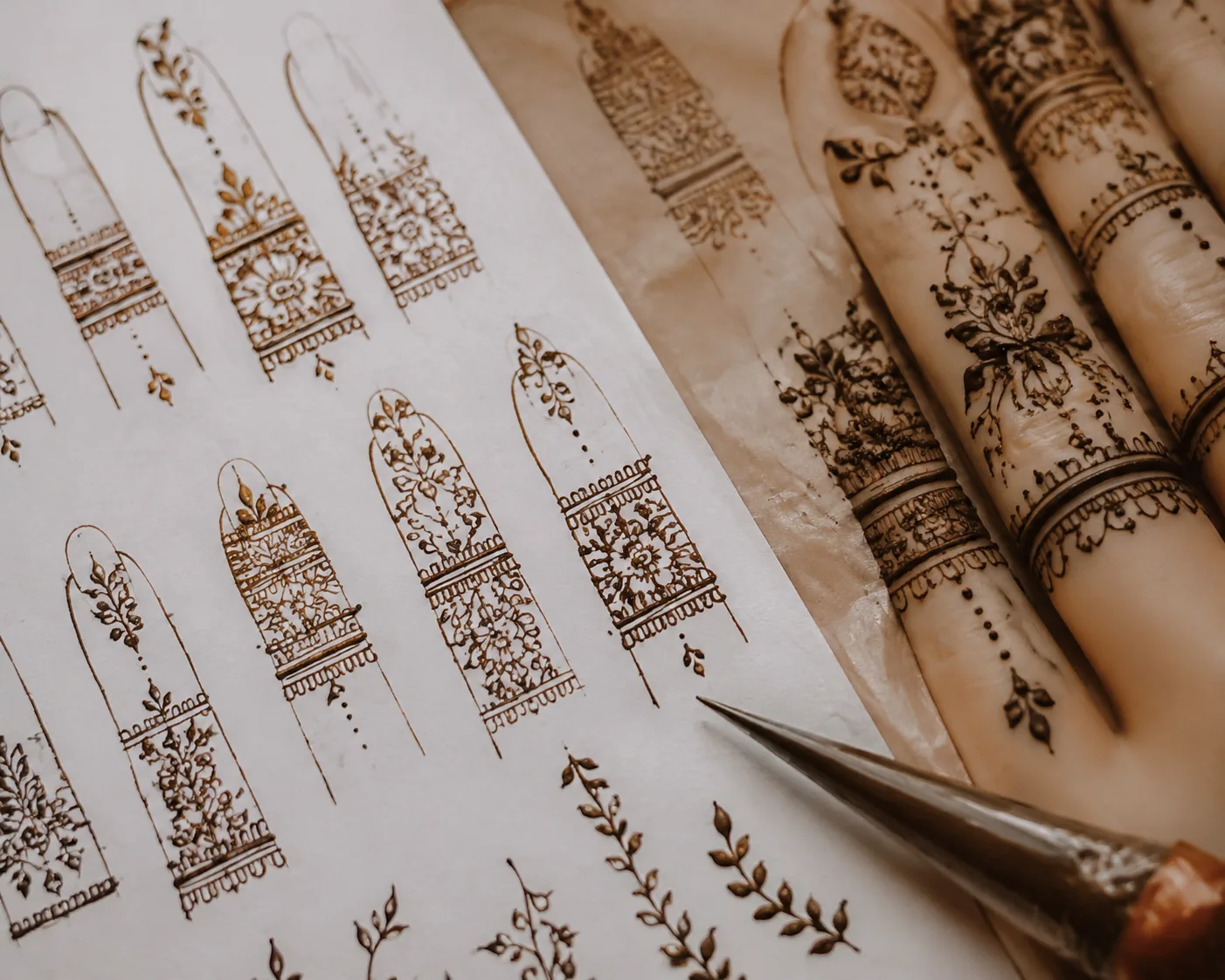 Finger mehndi design sketches and henna cone