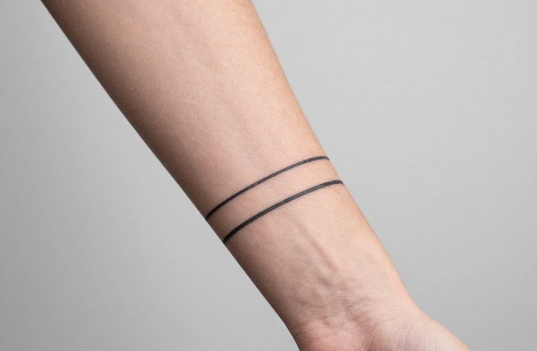 Forearm Two Lines Tattoo Meaning: Symbolism & Style