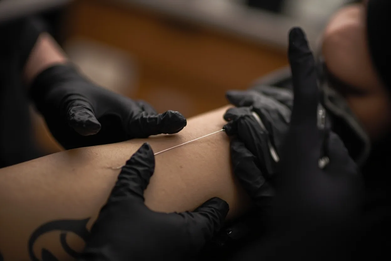 Outer arm tattoo session for a first timer