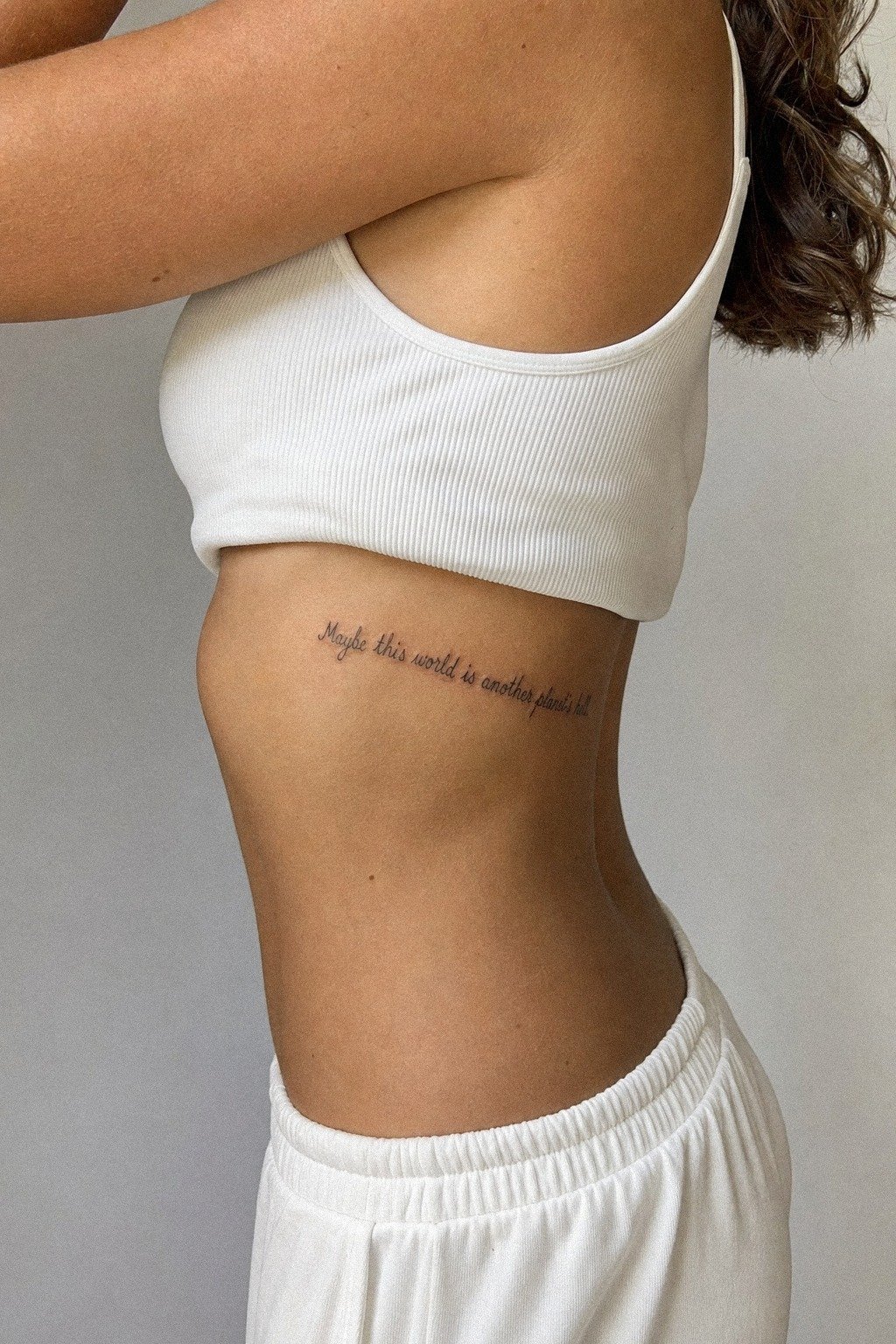 Single Needle Rib Quote Tattoo