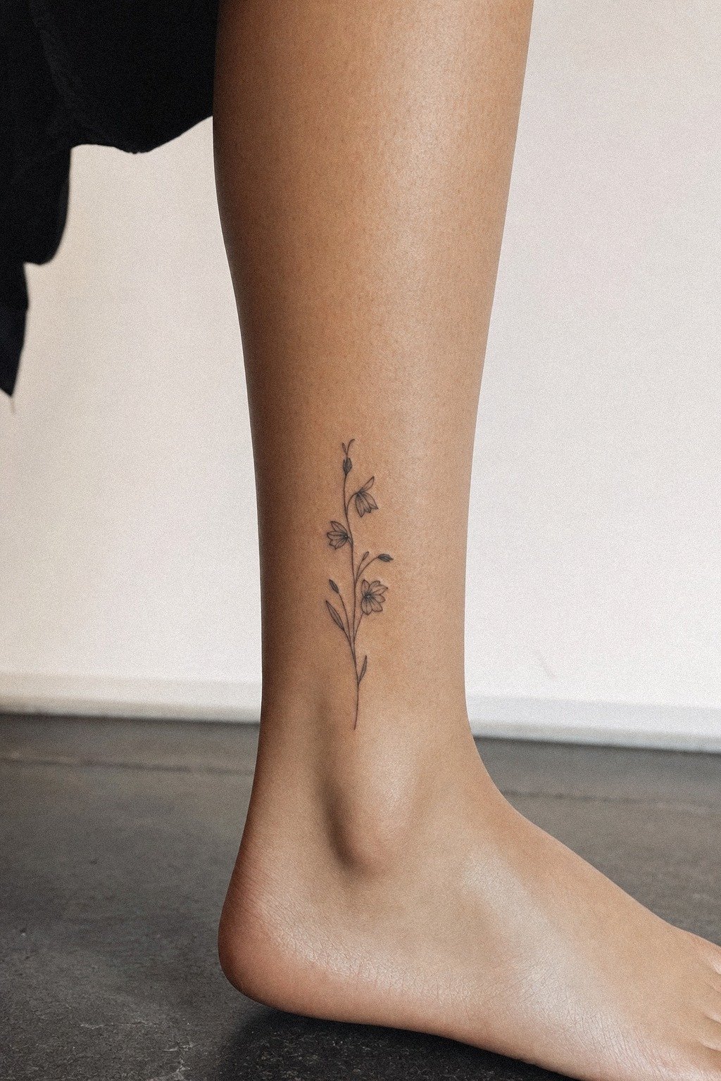 Fine Line Birth Flower Ankle Tattoo