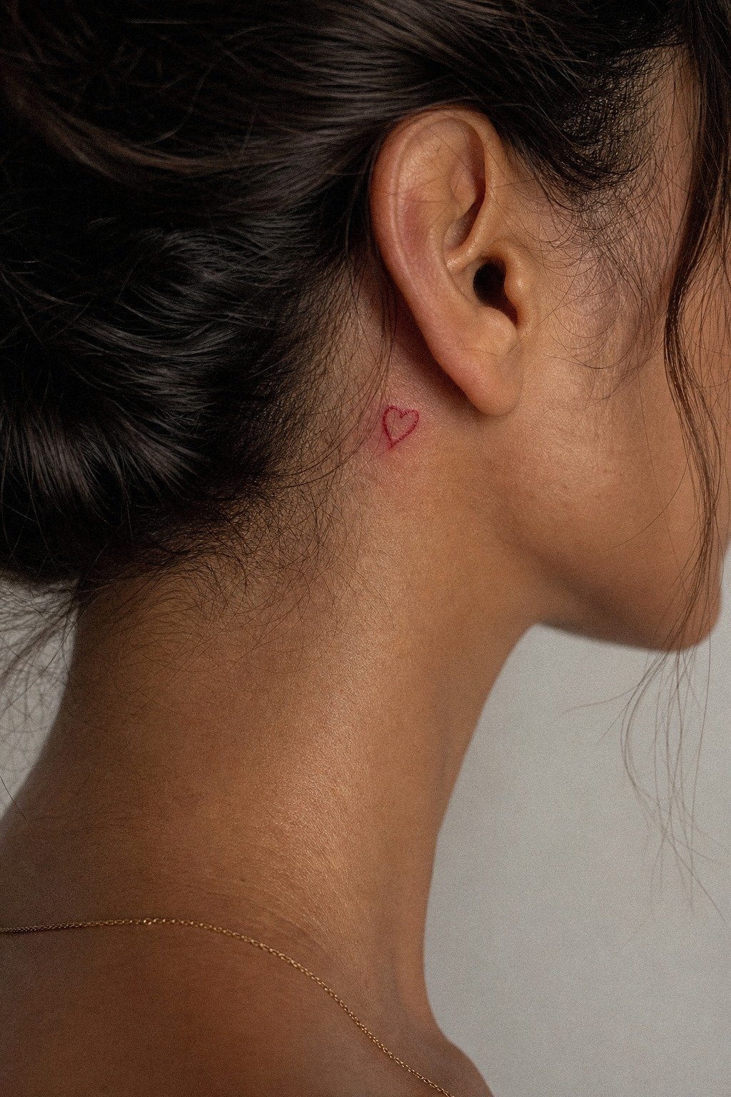 Tiny Red Ink Heart Tattoo