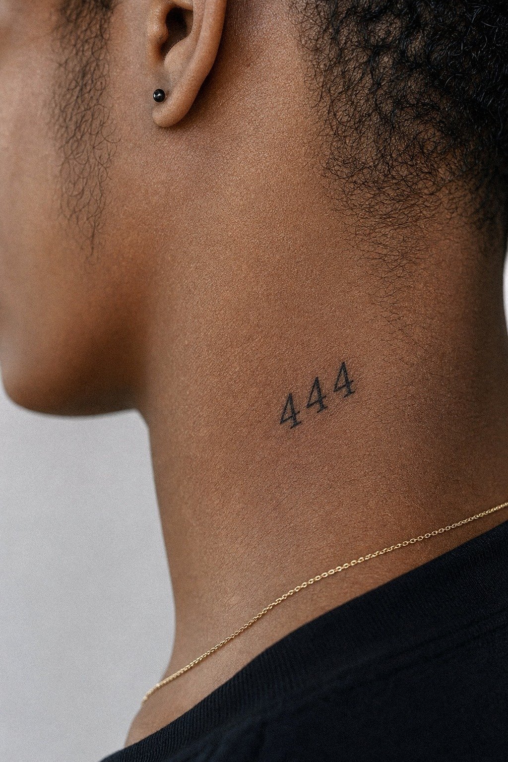 Minimal Angel Number Neck Tattoo