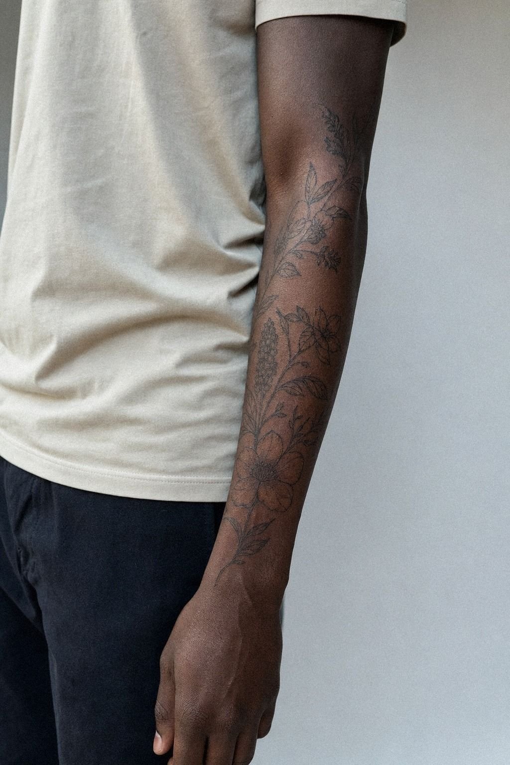 Negative Space Floral Sleeve Tattoo