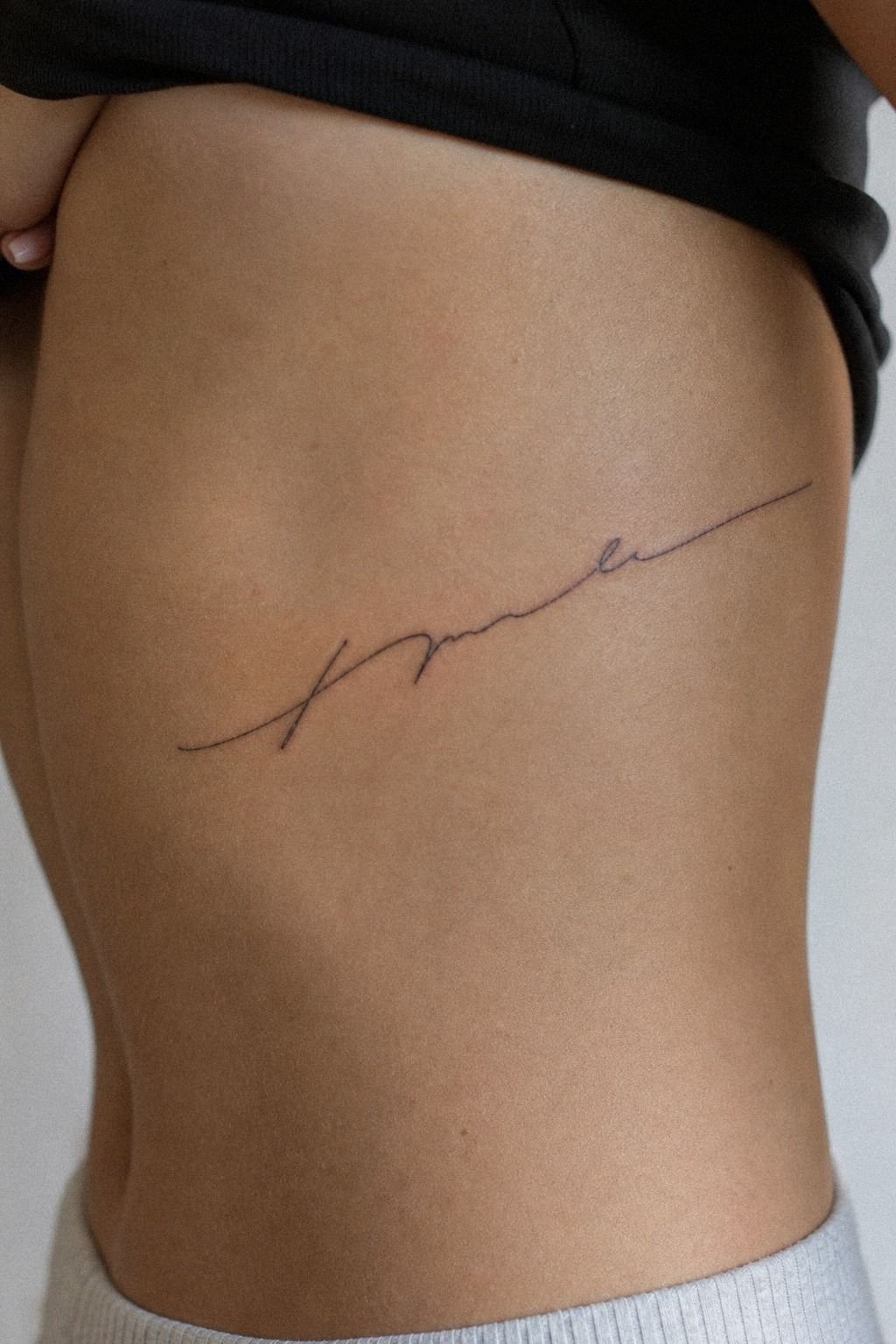 Tiny Boyfriend Name Rib Tattoo