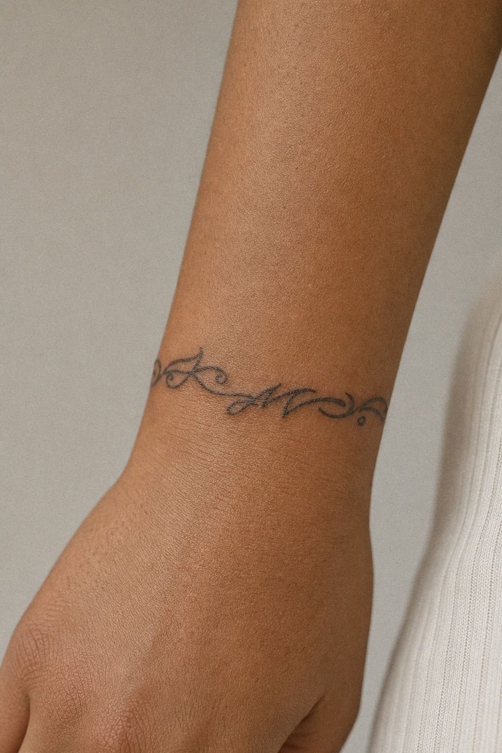 Name Bracelet Tattoo Around Wrist