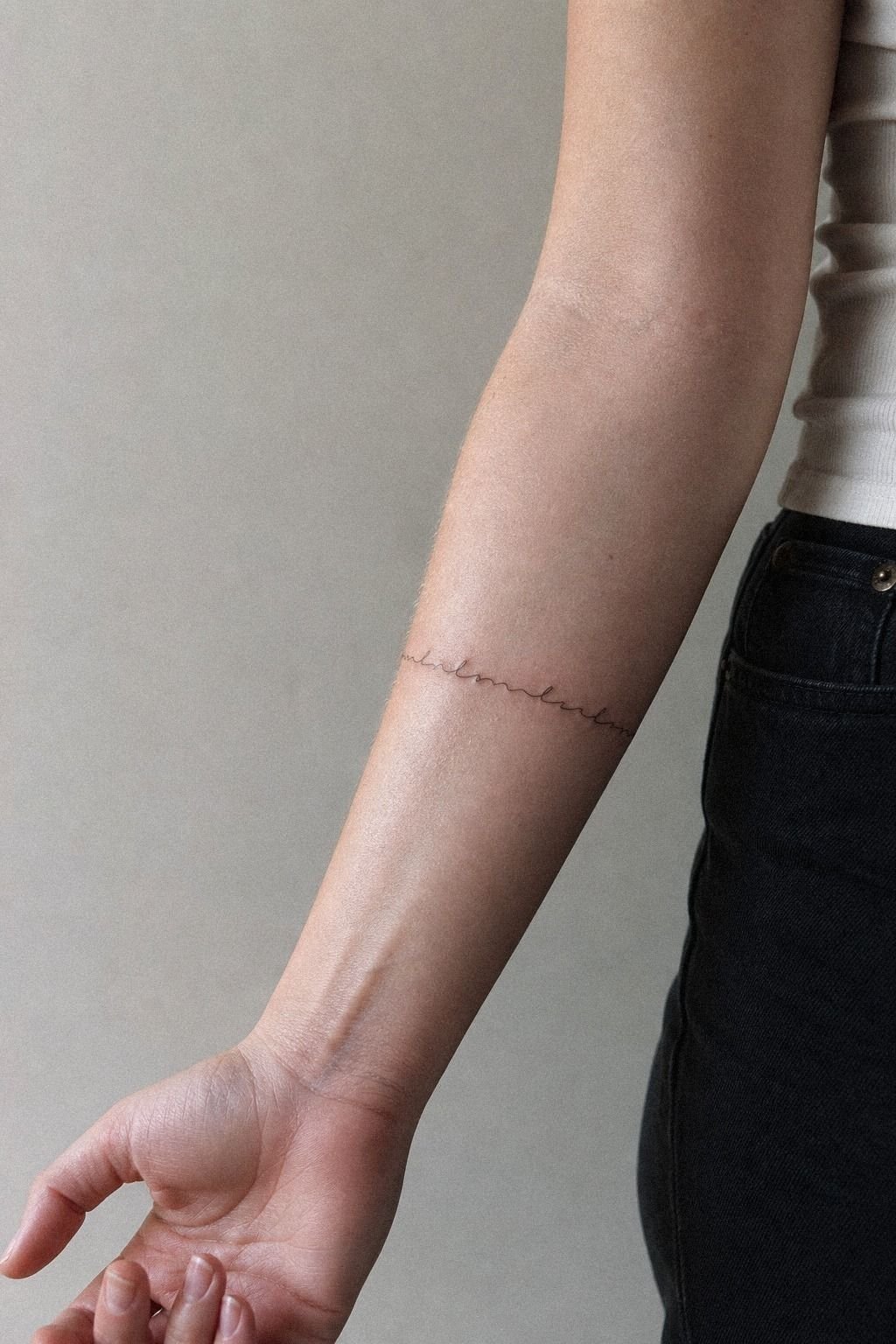 Micro Name Tattoo On Inner Arm