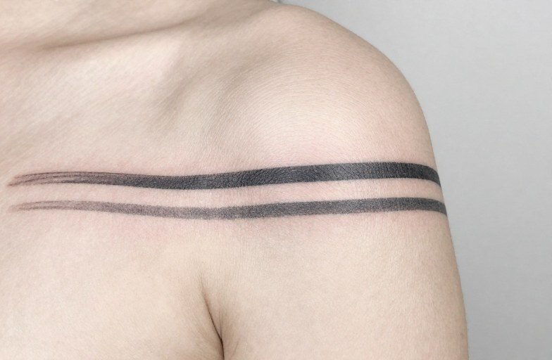 Two Stripes Tattoo Meaning: Symbolism, Styles & Placement