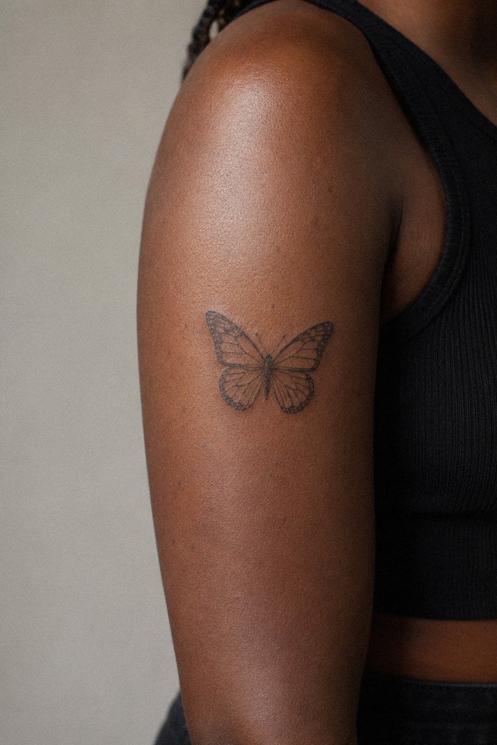 Frame a Delicate Butterfly on the Upper Arm