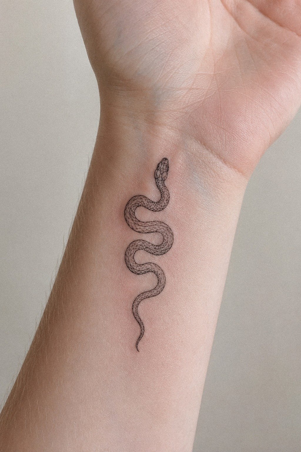 Sized A Tiny Snake Wrist Tattoo Properly