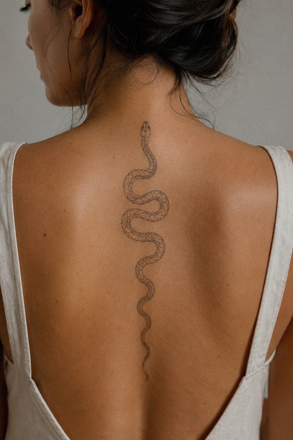 Sat Through A Spine Snake Tattoo Session