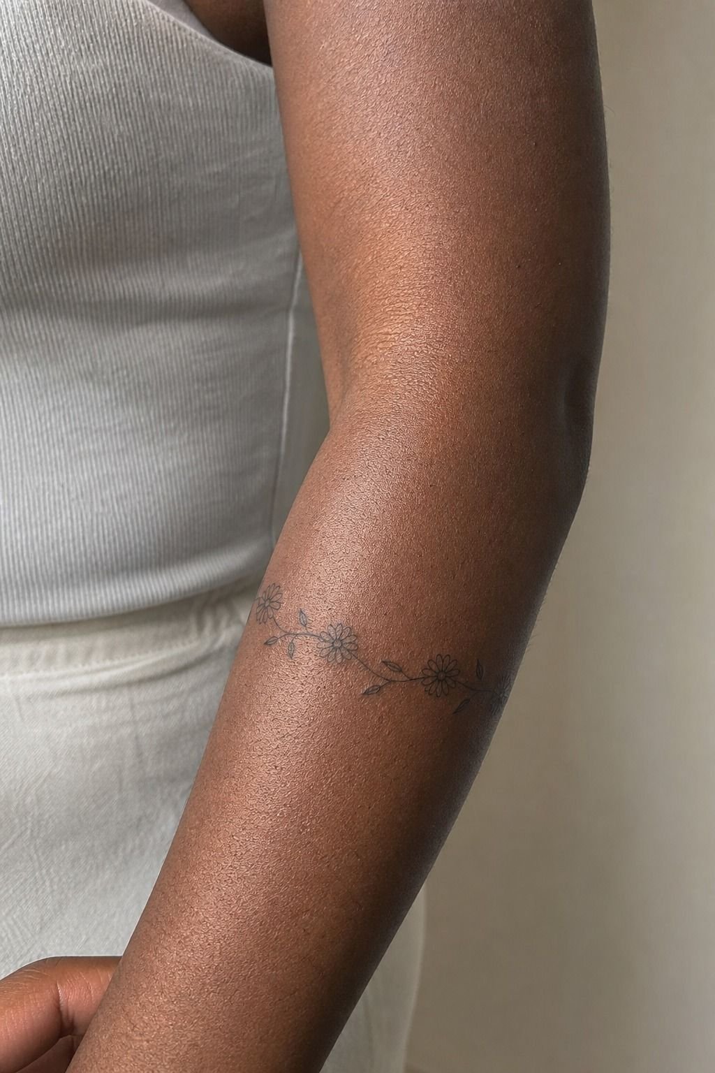 Wrap a delicate daisy chain around the forearm