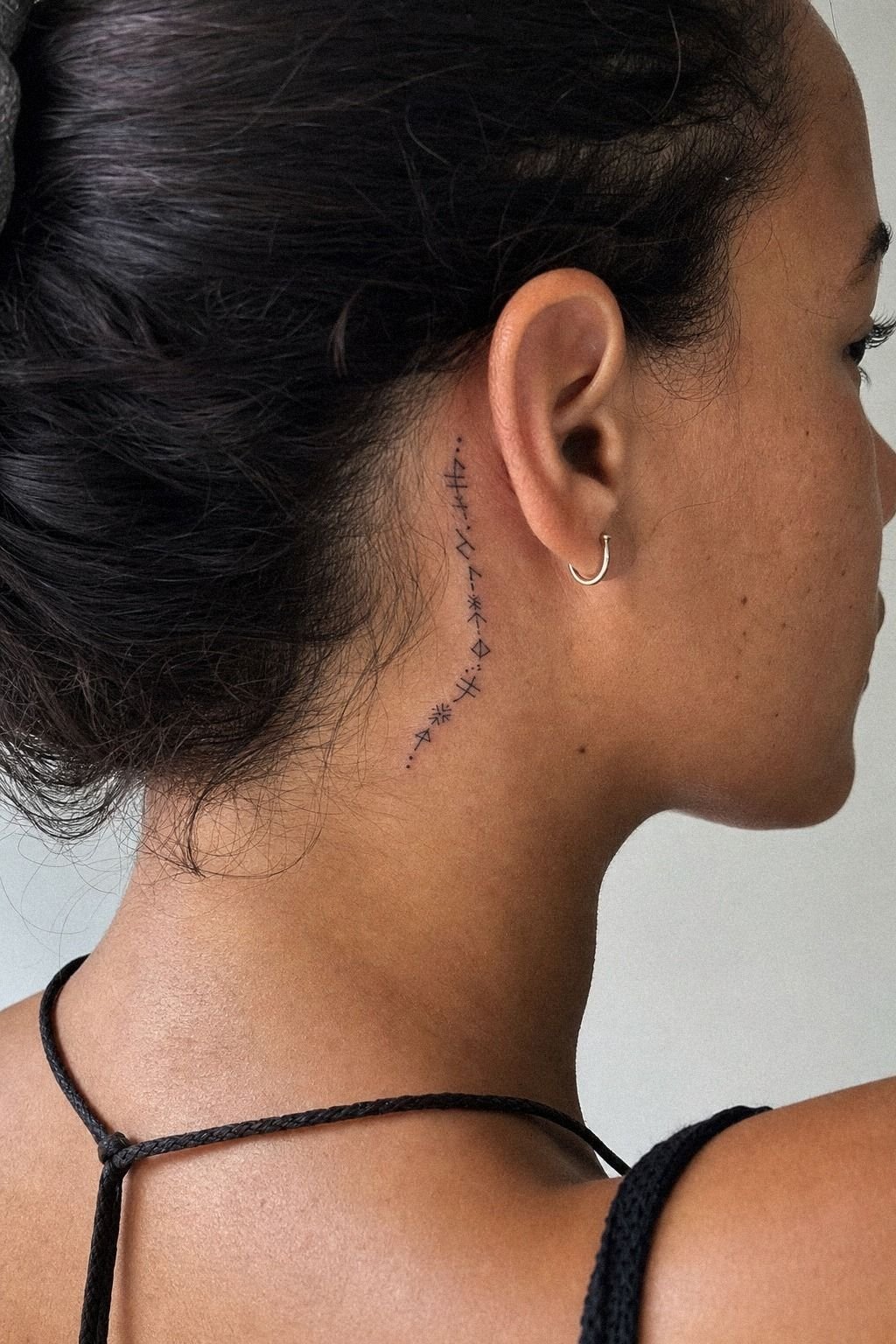 Tiny Rune Tattoo Behind The Ear