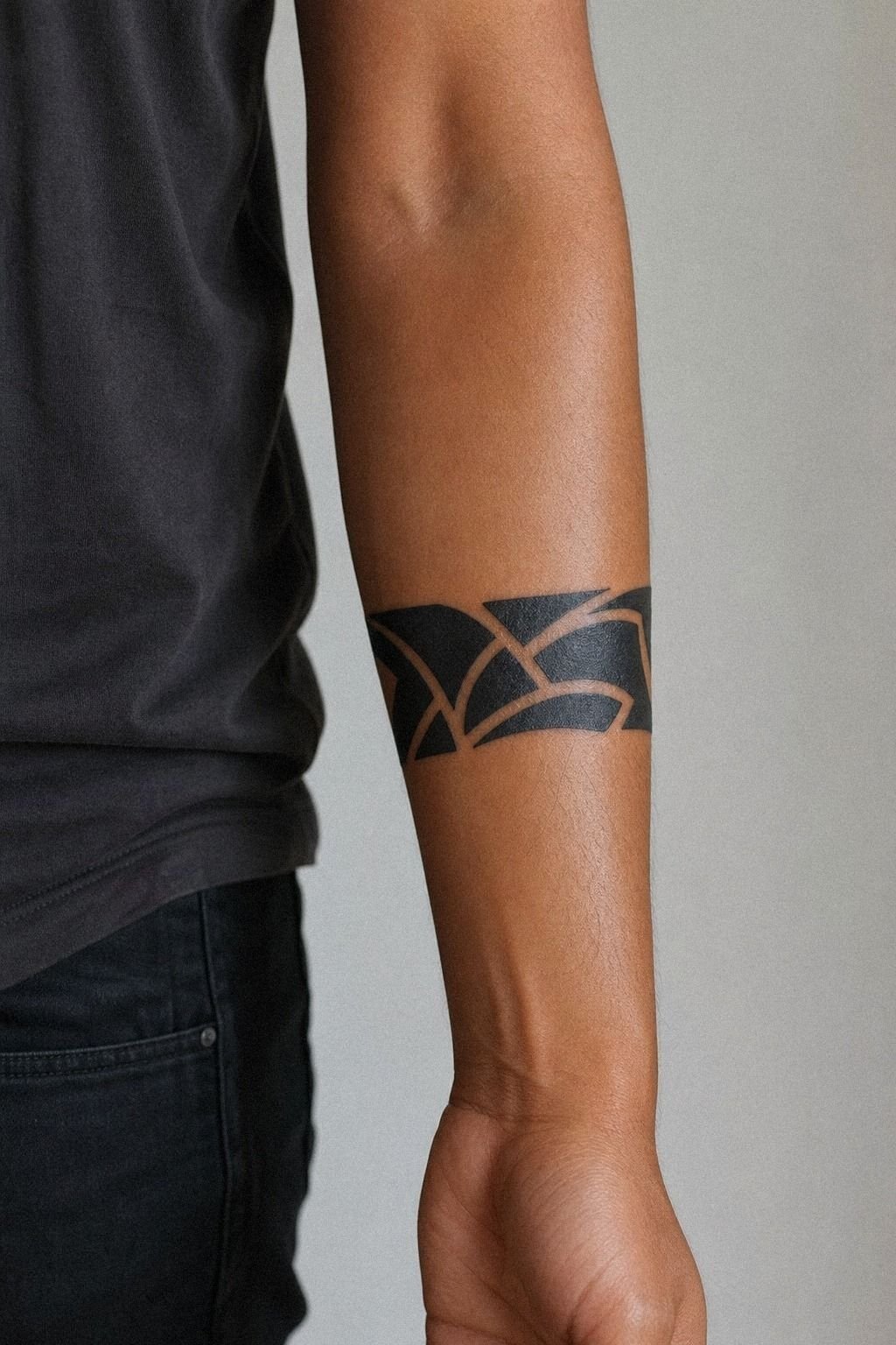 Bold Blackwork Word Across The Forearm