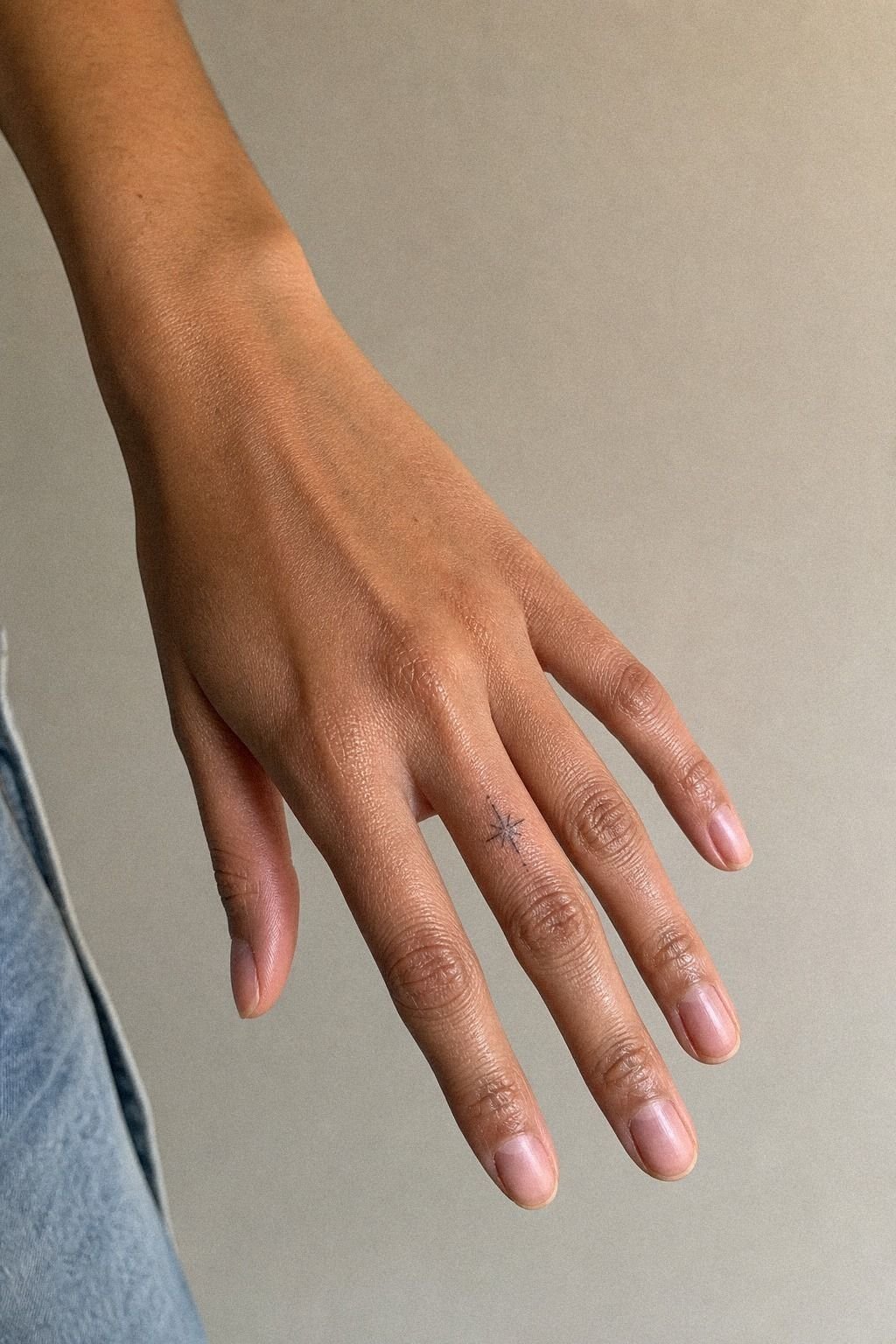Minimal Finger Word Tattoo With Personal Meaning
