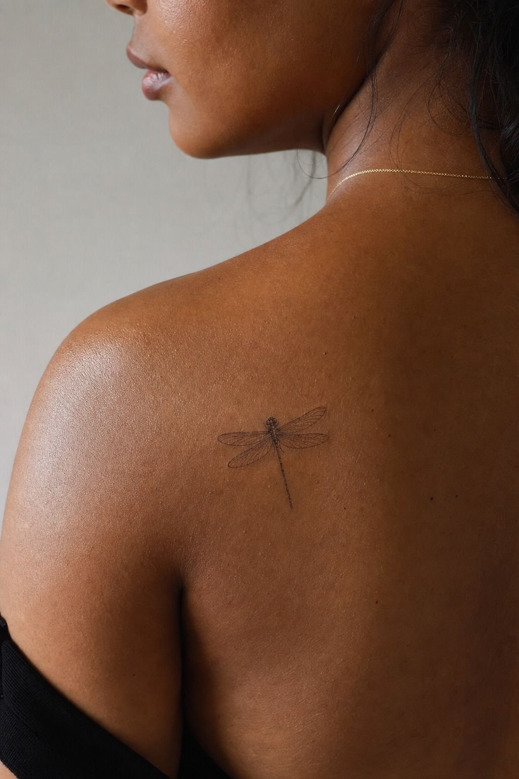 Small Dragonfly Shoulder Blade Tattoo
