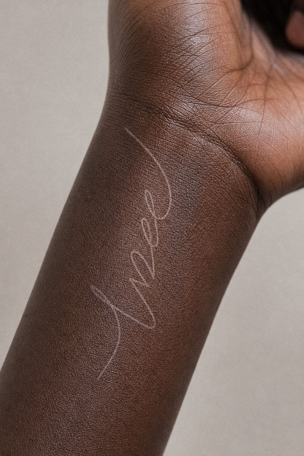 White Ink Word Tattoo For Subtle Skin
