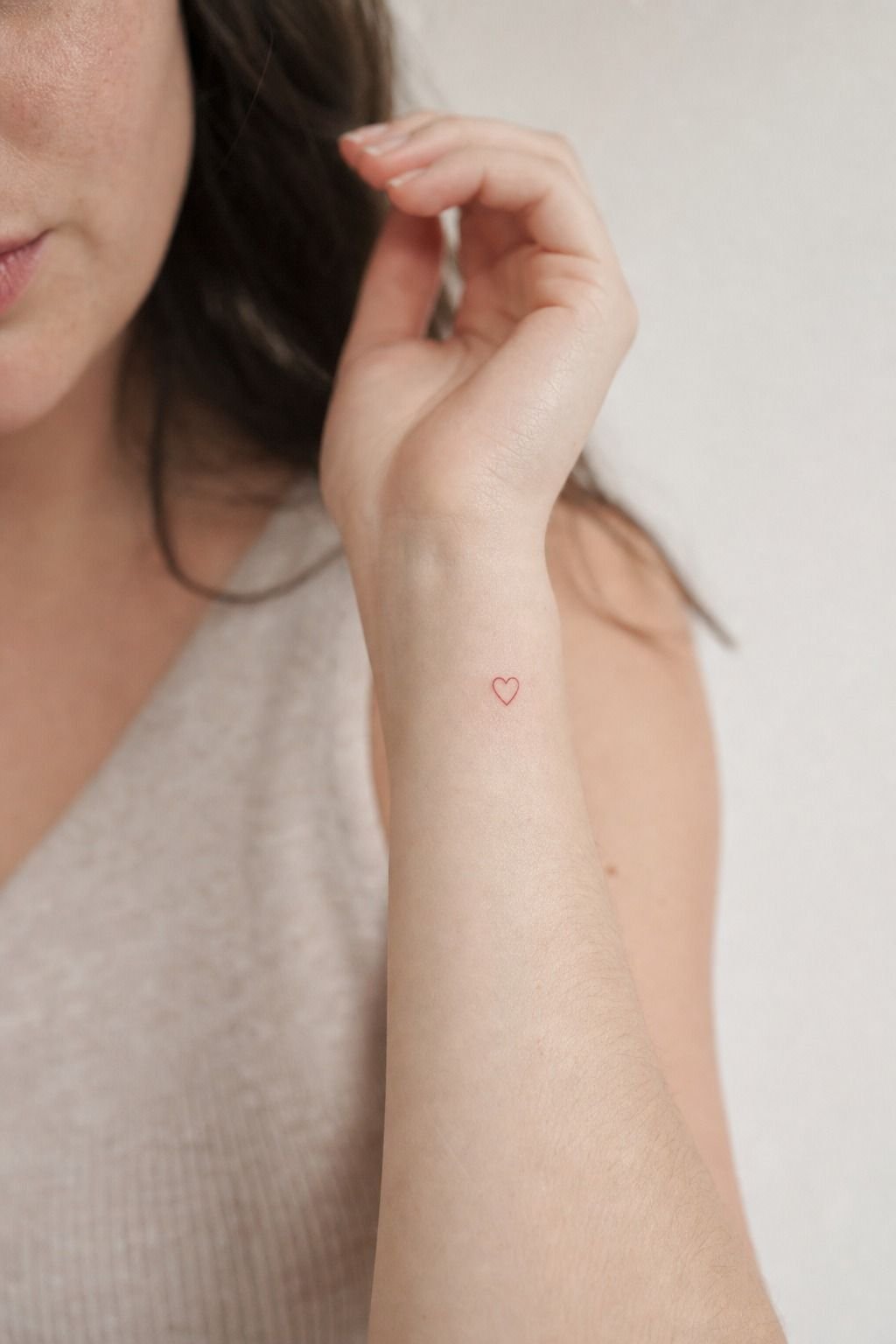Tiny Red Heart Wrist Tattoo