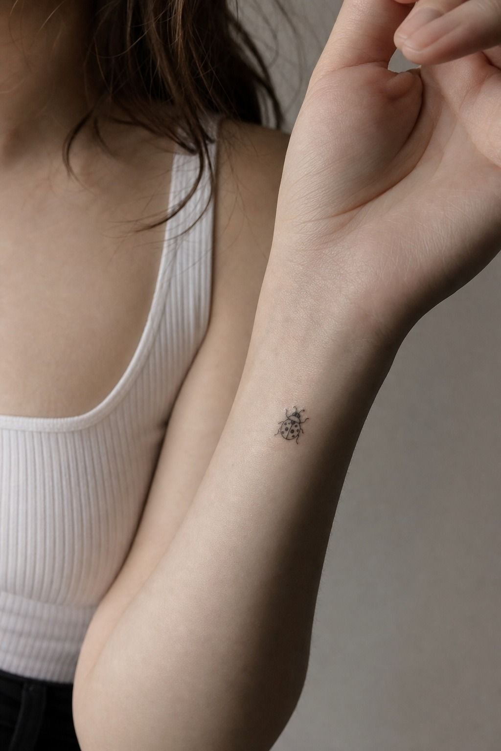 Start With a Fine Line Ladybug Wrist Tattoo