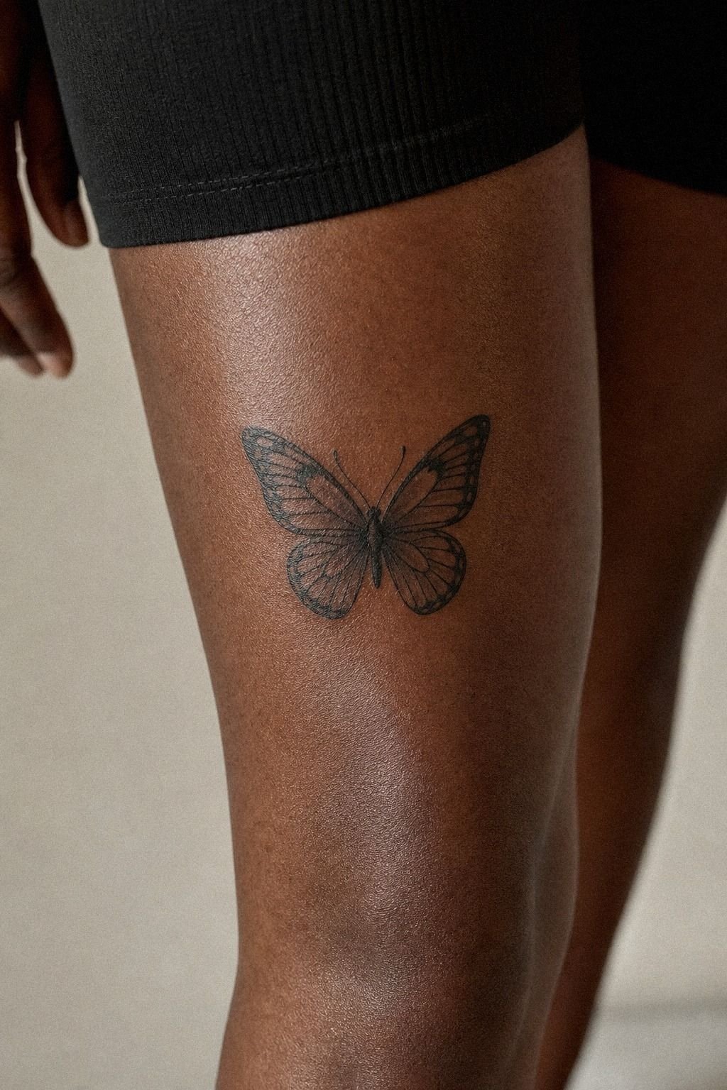 Butterfly Above Knee Tattoo With Soft Shading