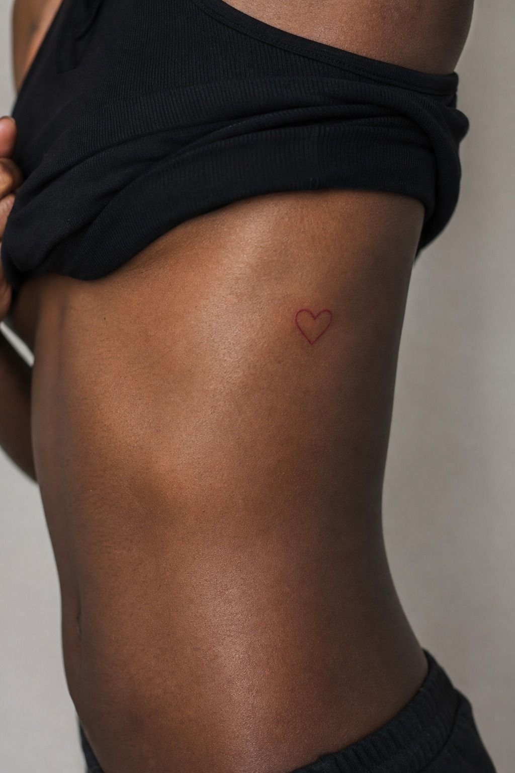 Red Outline Against the Curve of the Ribs