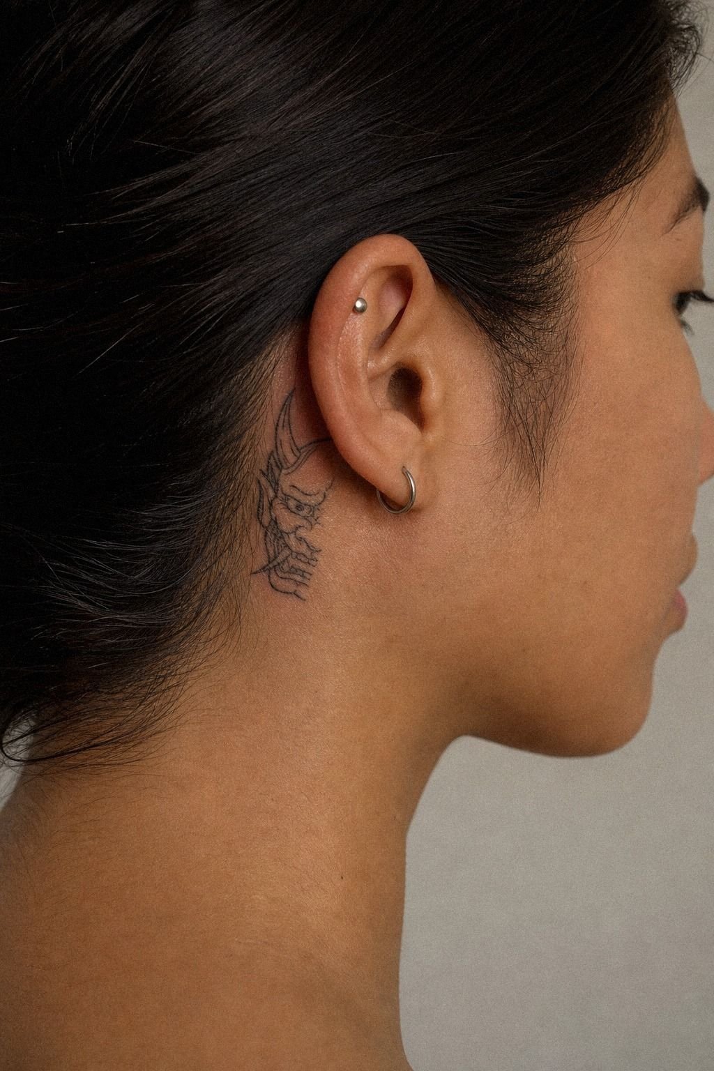 Small Oni Tattoo Behind The Ear