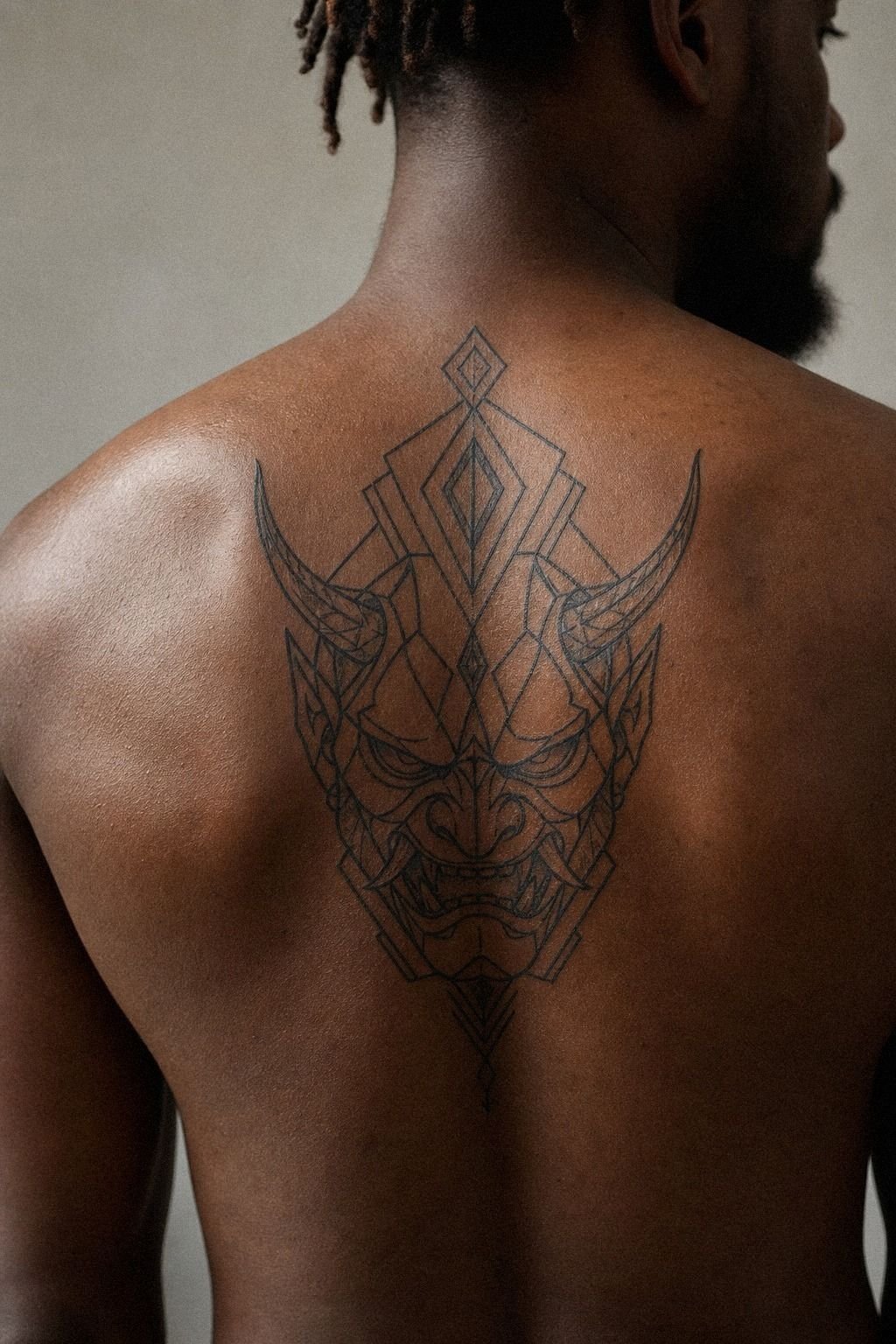 Geometric Oni Tattoo With Sharp Linework