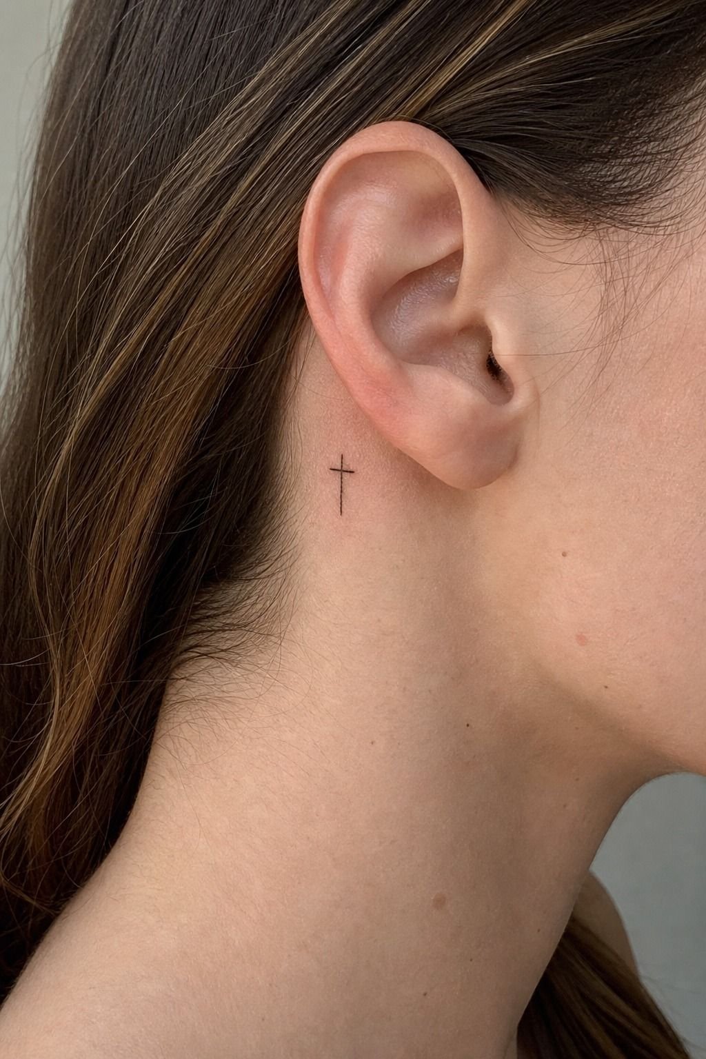 Place a Fine Line Cross Behind the Ear
