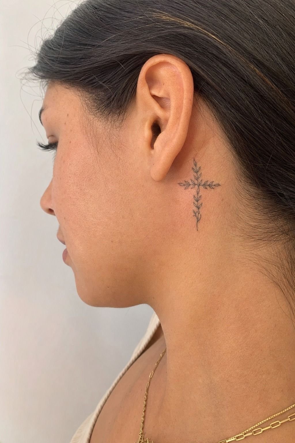 Olive Branch Against a Solid Cross