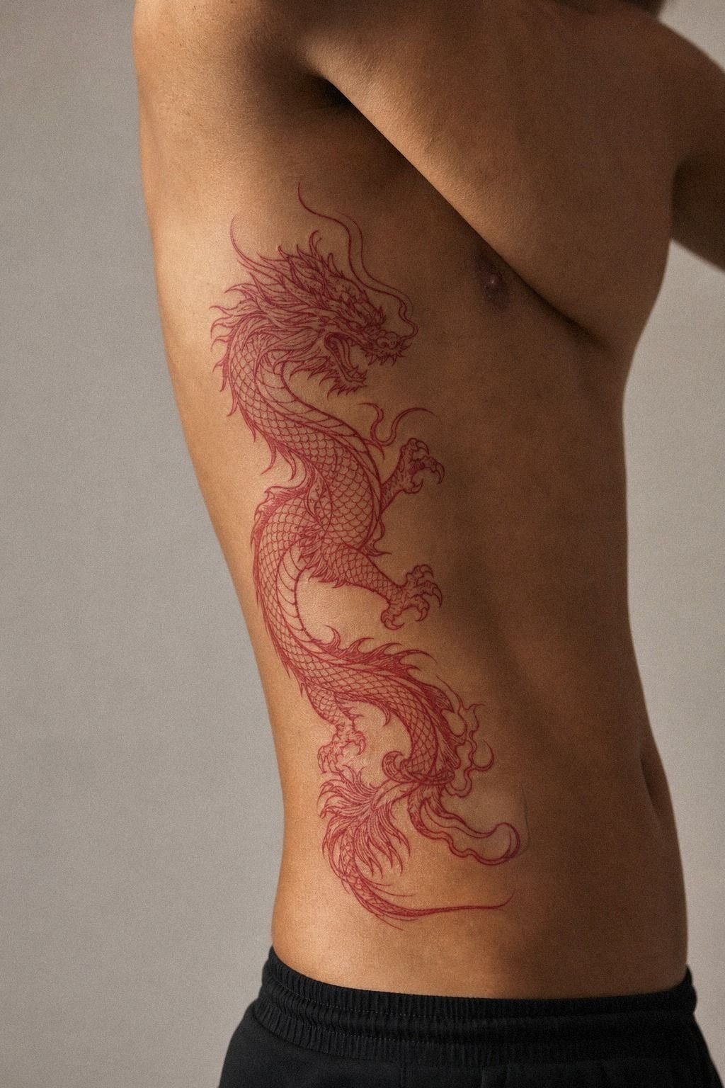 Red Ink vs Black on a Japanese Dragon Rib Tattoo
