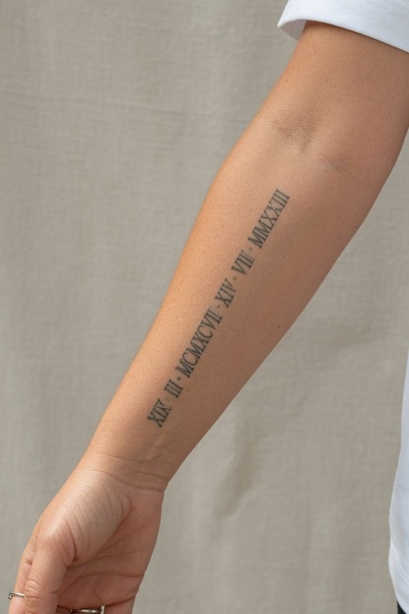 Roman Numeral Dates Running Along the Forearm