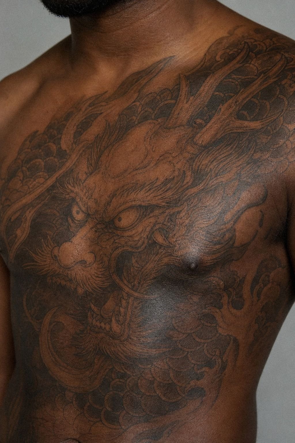 Hannya Contrast: Japanese Dragon Mask Chest Tattoo