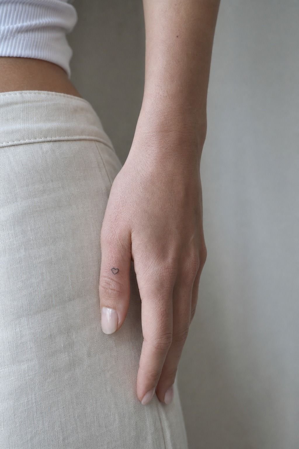 Start with a tiny heart on the side of your finger