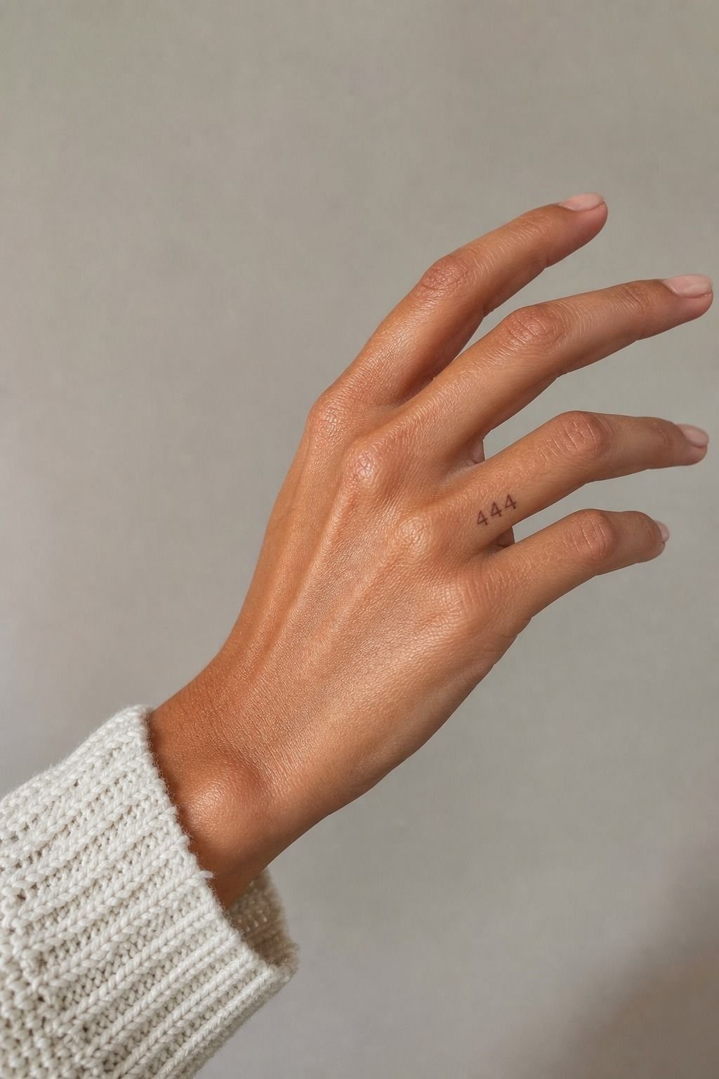 Style a soft angel number beside your index finger