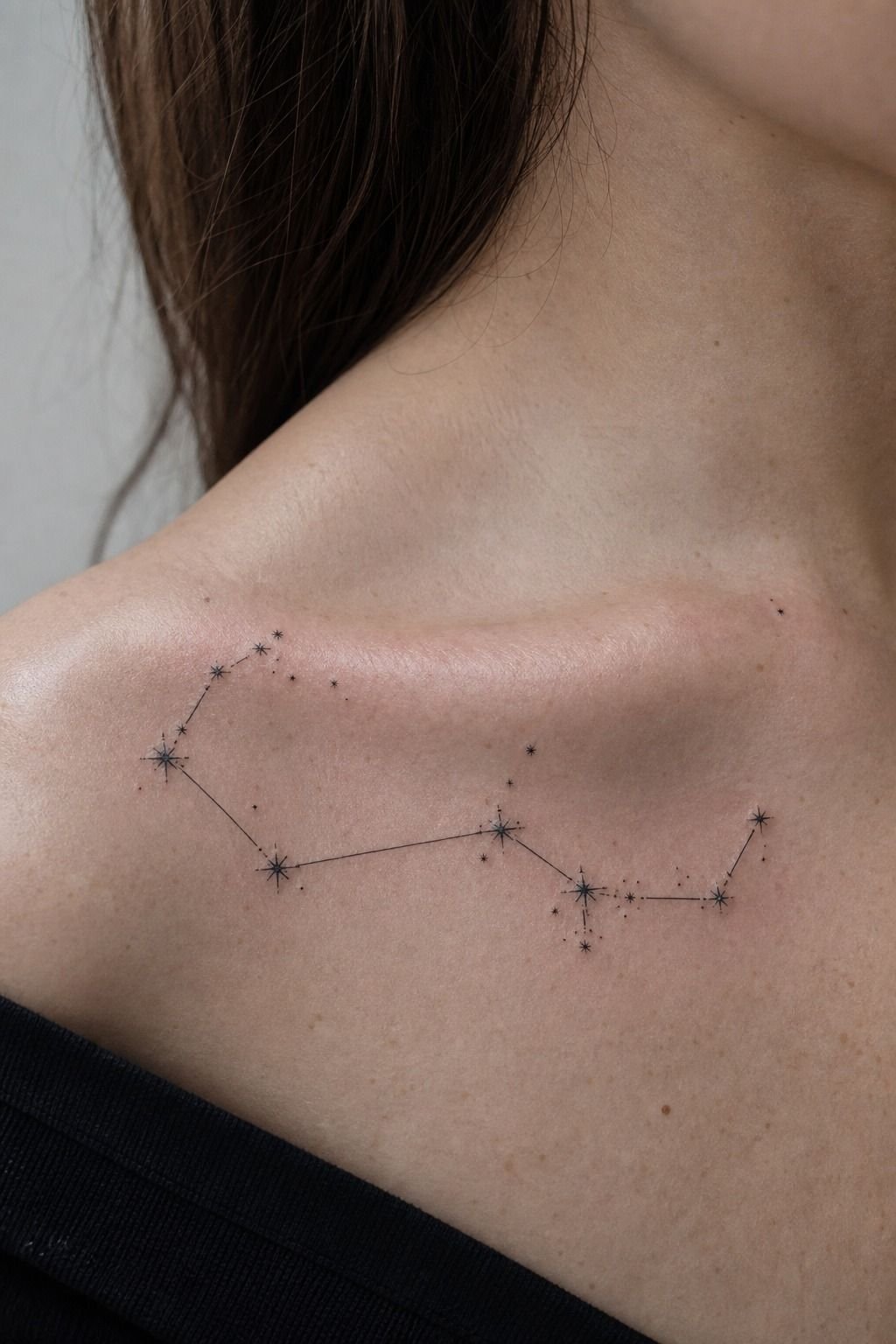 Delicate Zodiac Constellation Collarbone Tattoo