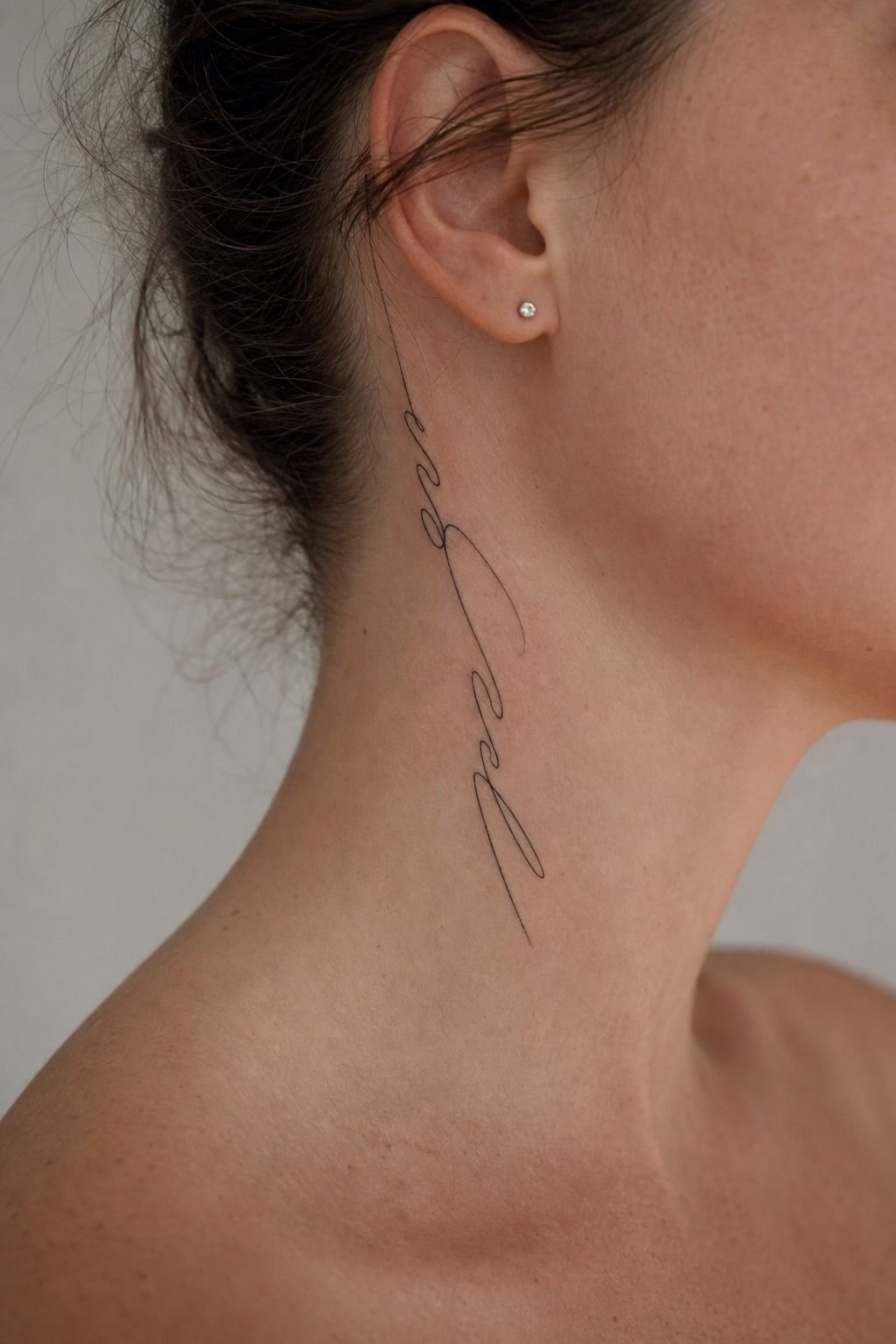 Fine Line Script Along the Side of the Neck