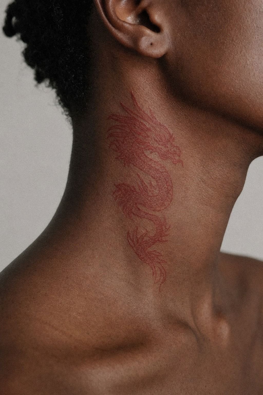 Red Ink Side Neck Tattoo Design