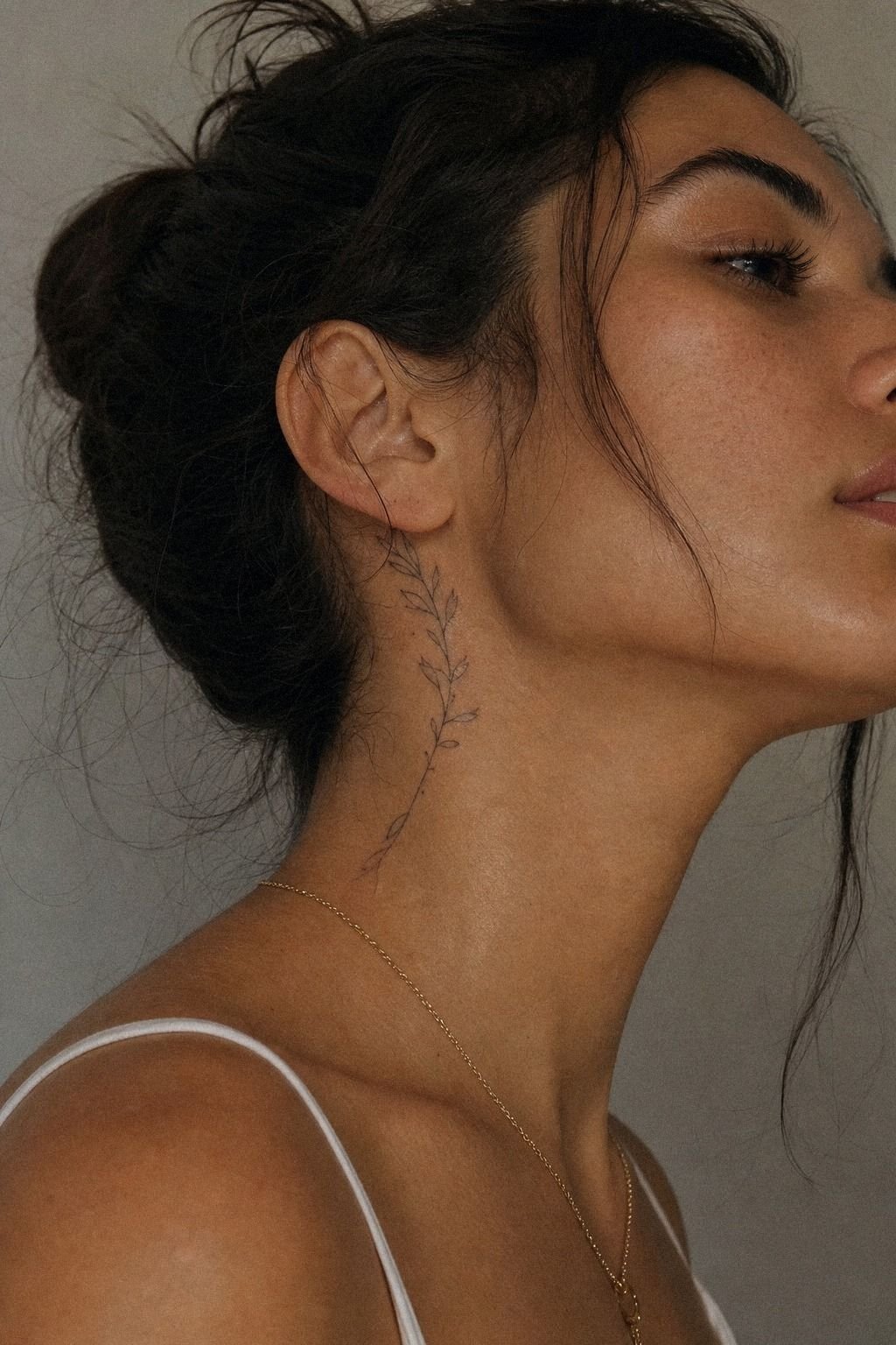 Delicate Side Neck Tattoo Along The Jawline