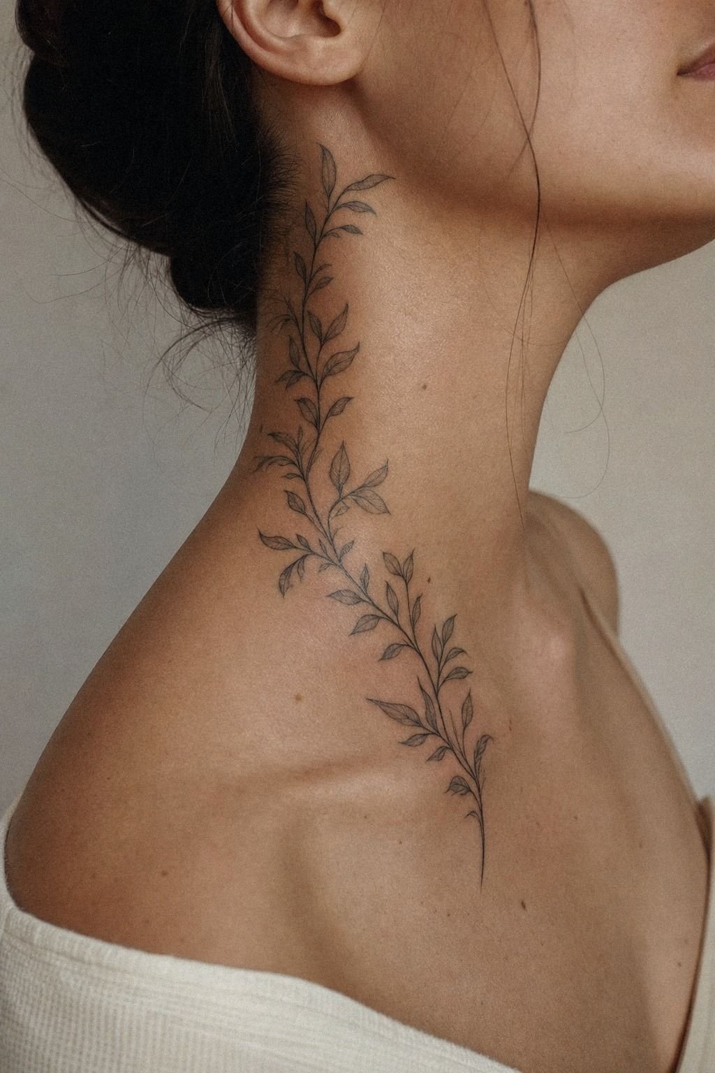 Botanical Side Neck Tattoo With Soft Leaves