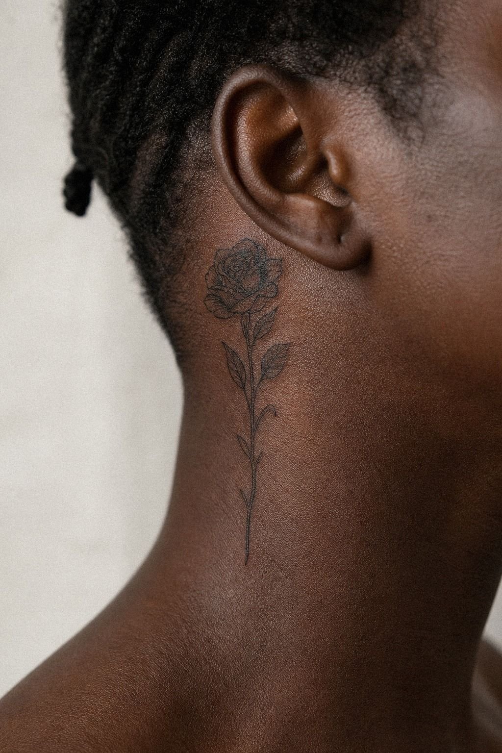 Tiny Side Neck Tattoo Near The Hairline