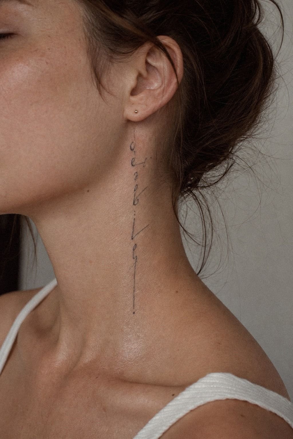 Vertical Side Neck Tattoo With Clean Lettering