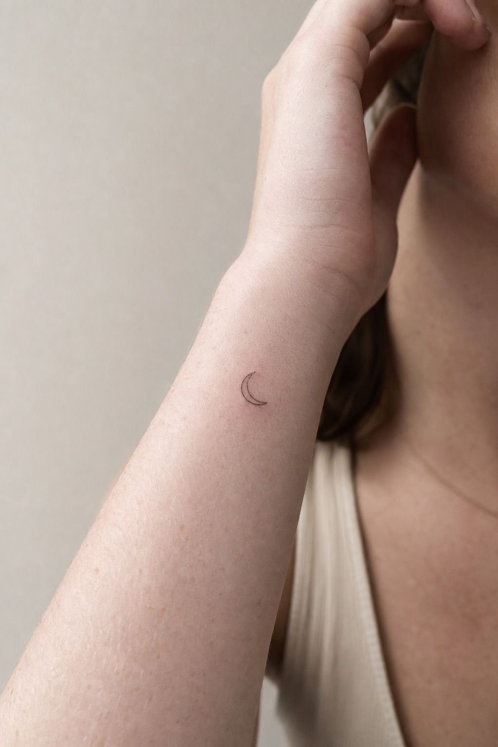 Fine Line Half Moon Wrist Tattoo