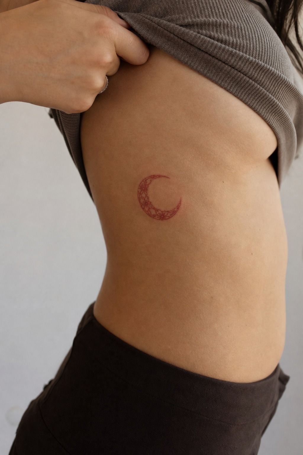 Red Ink Half Moon Rib Tattoo