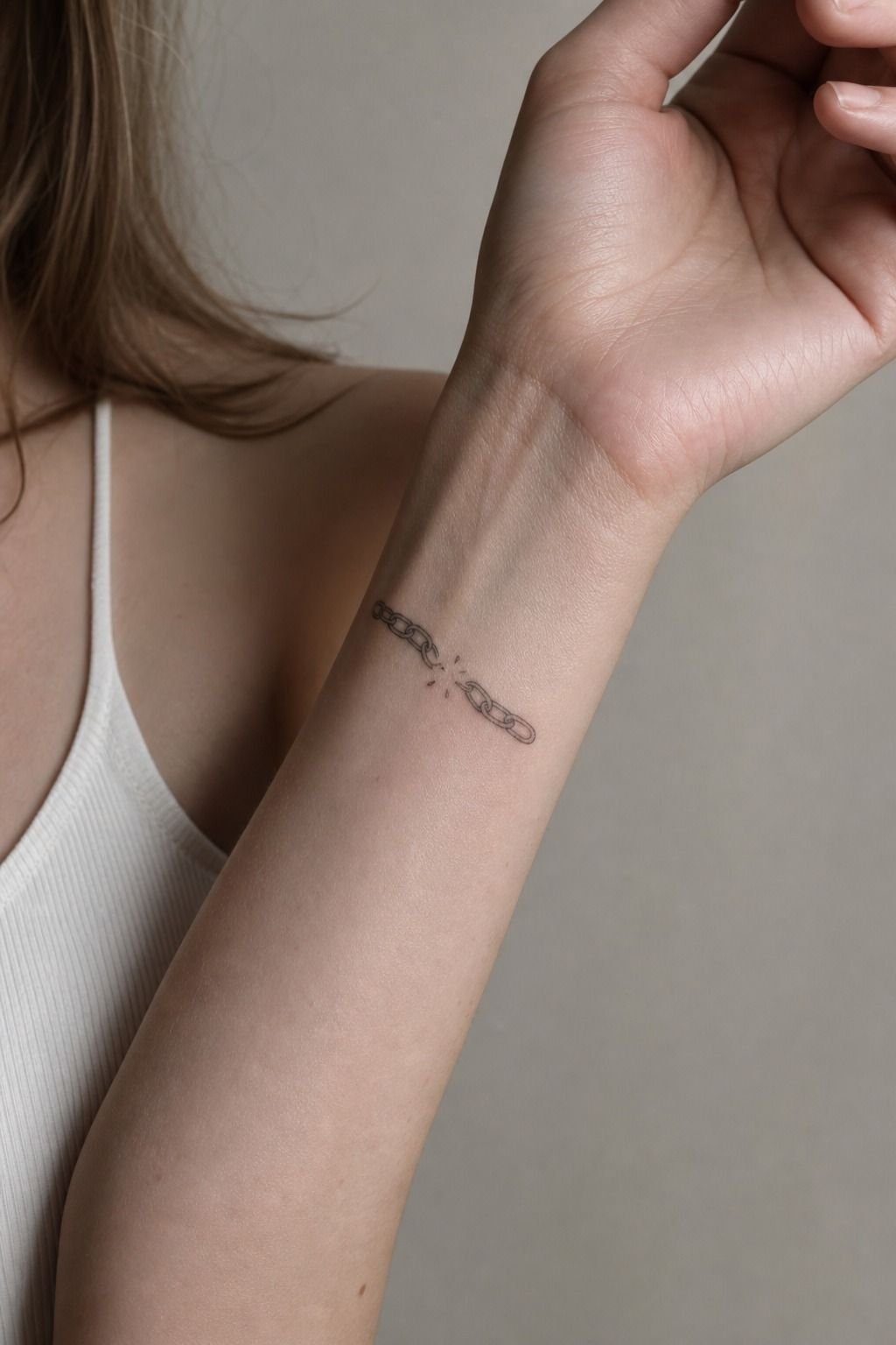 Break The Pattern With A Tiny Chain Wrist Tattoo