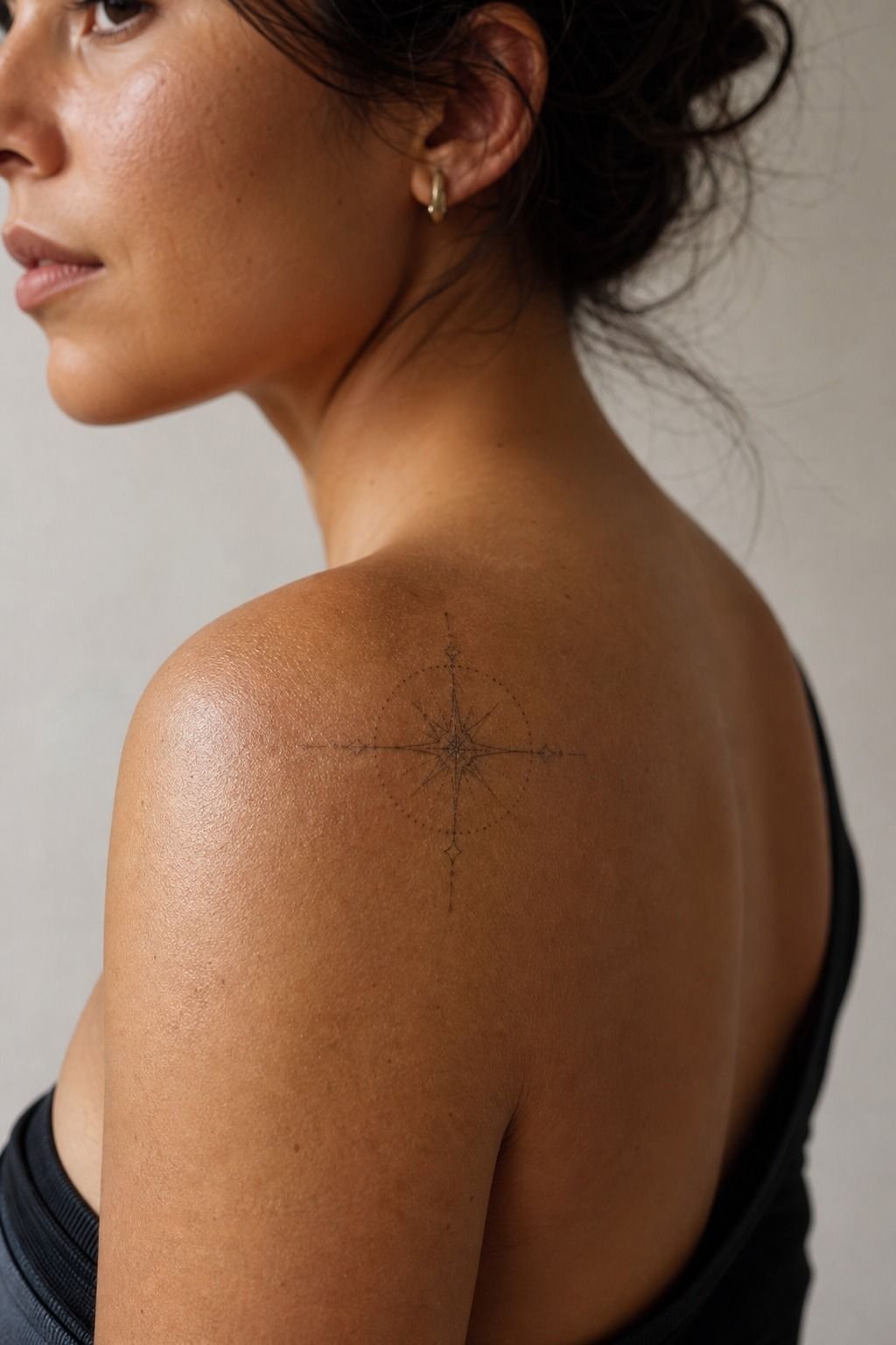 Place the central motif right at the deltoid peak
