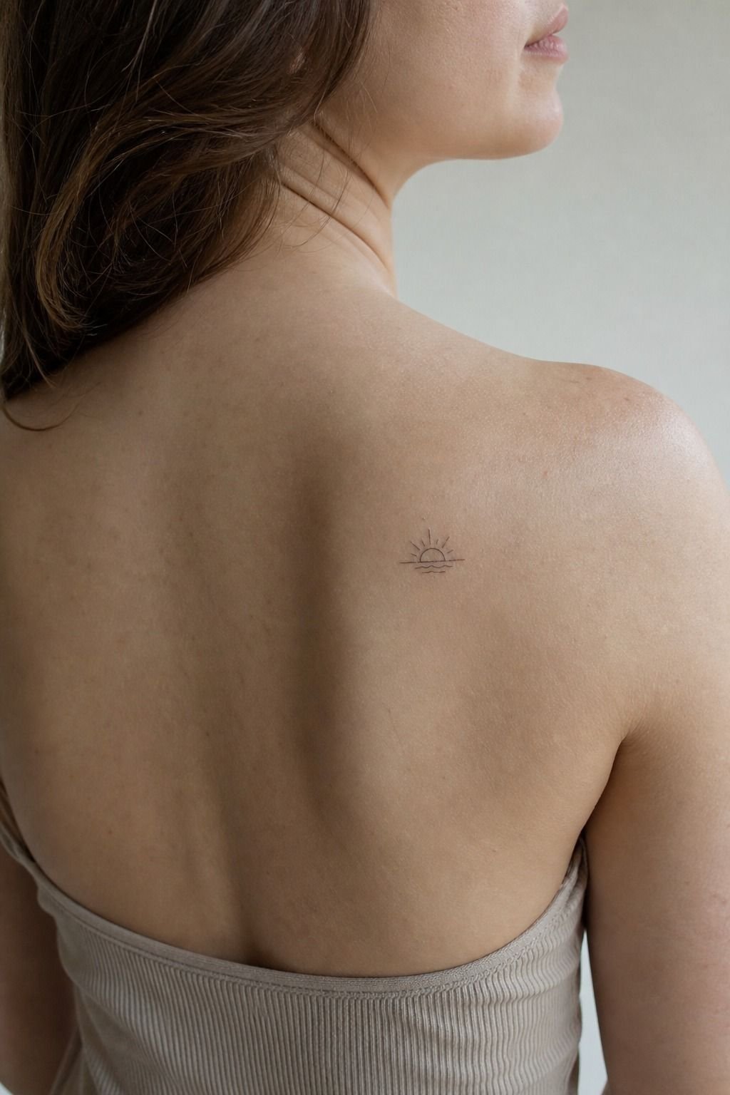 Small Meaningful Symbol Near the Back Shoulder