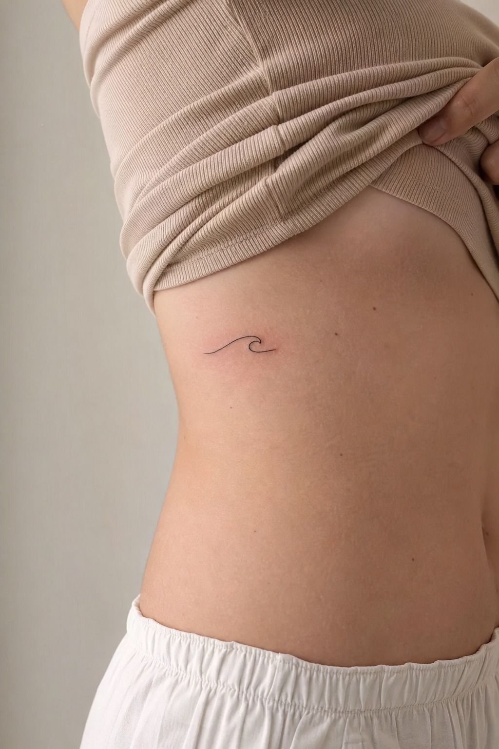 Start With A Tiny Wave Line Tattoo