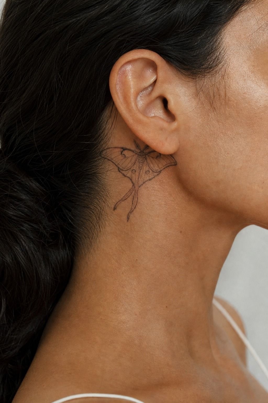 Minimal Luna Moth Behind The Ear Tattoo